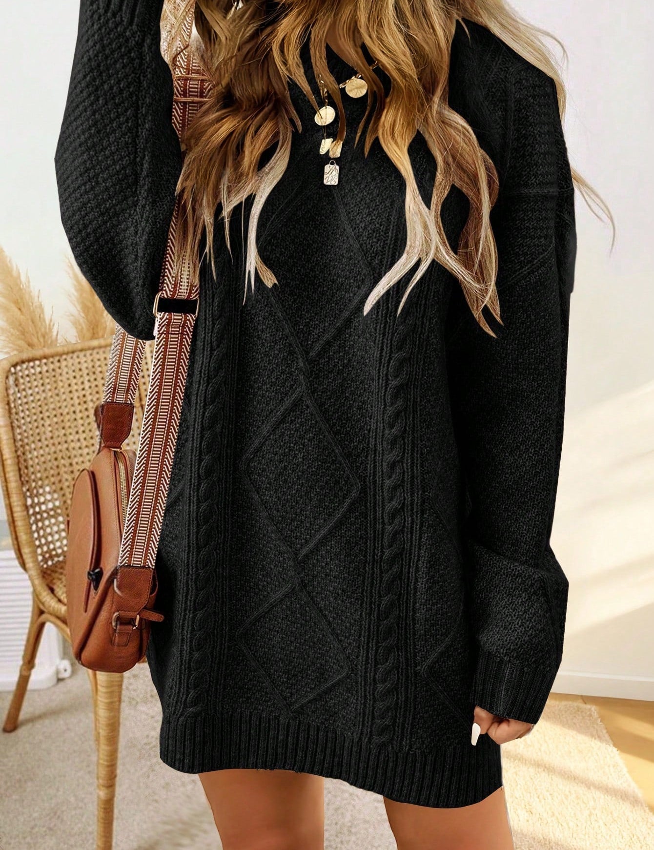 Trui jurk met kabelpatroon en ribbelafwerking