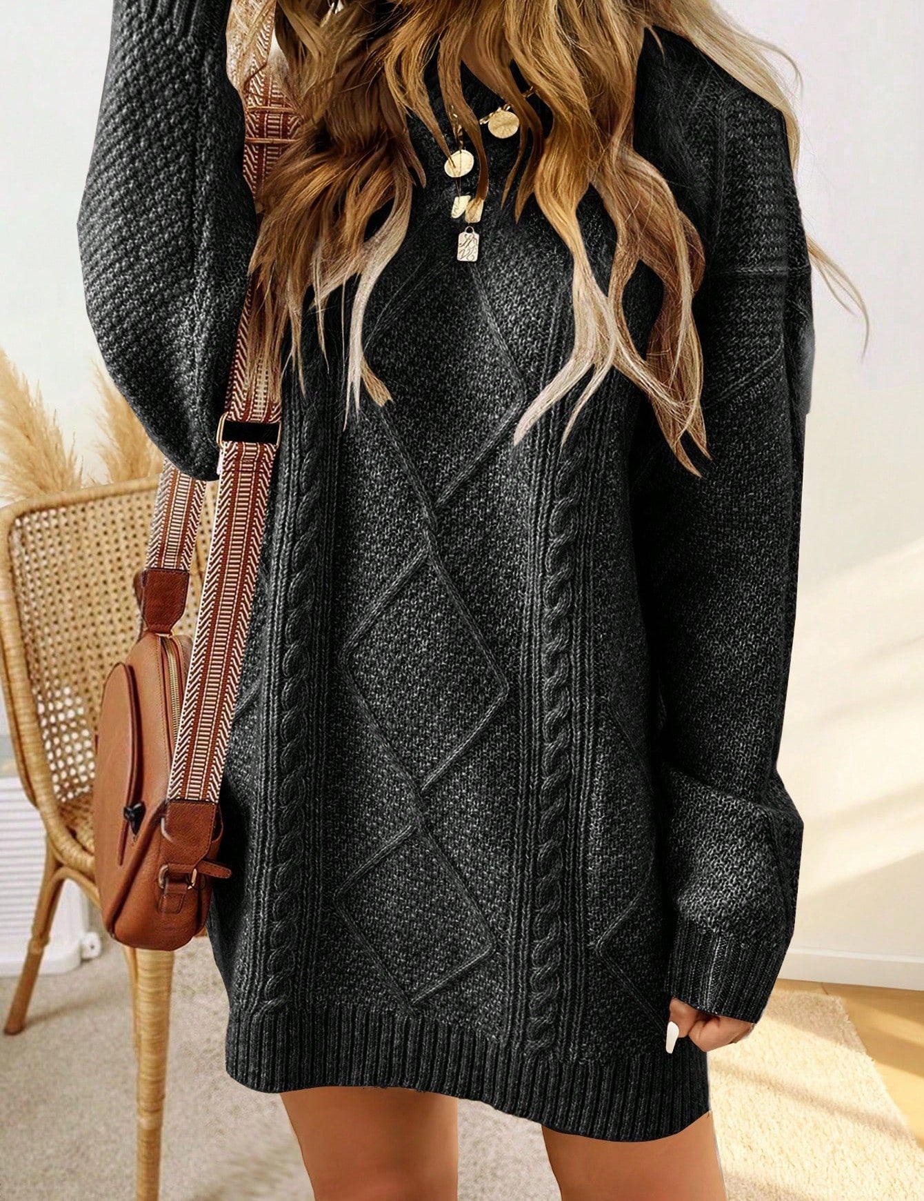 Trui jurk met kabelpatroon en ribbelafwerking