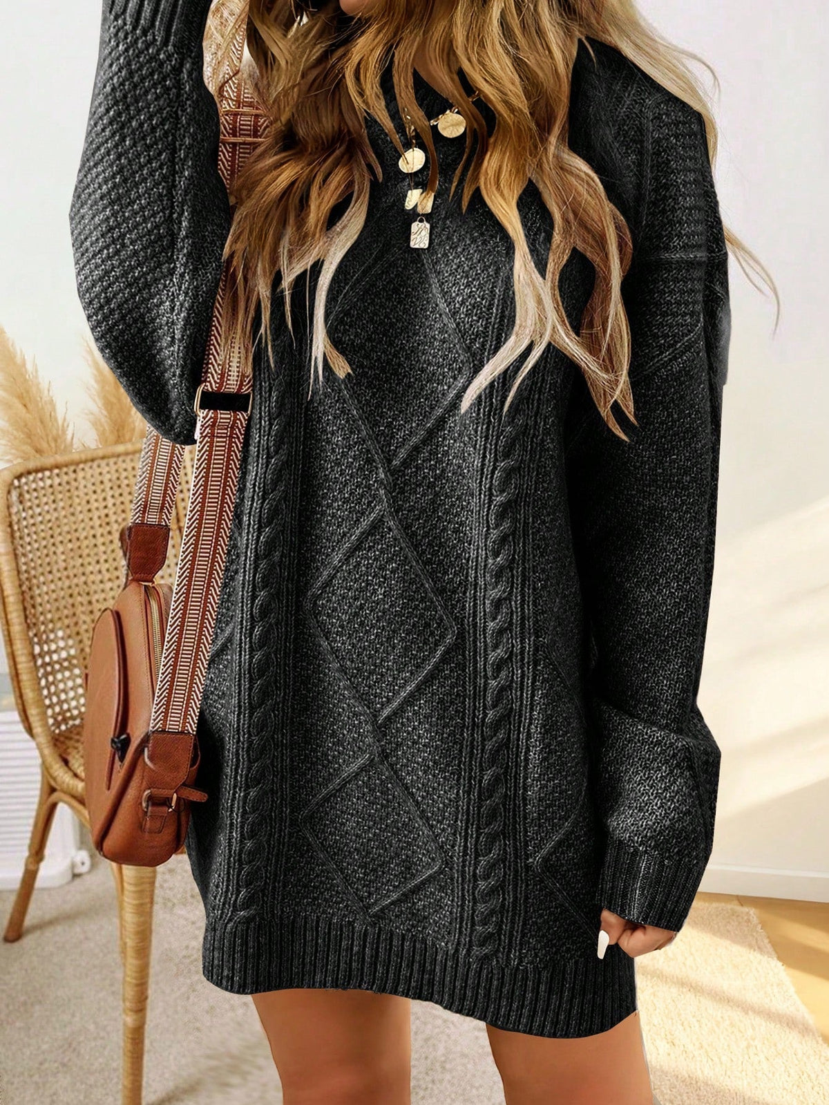 Trui jurk met kabelpatroon en ribbelafwerking