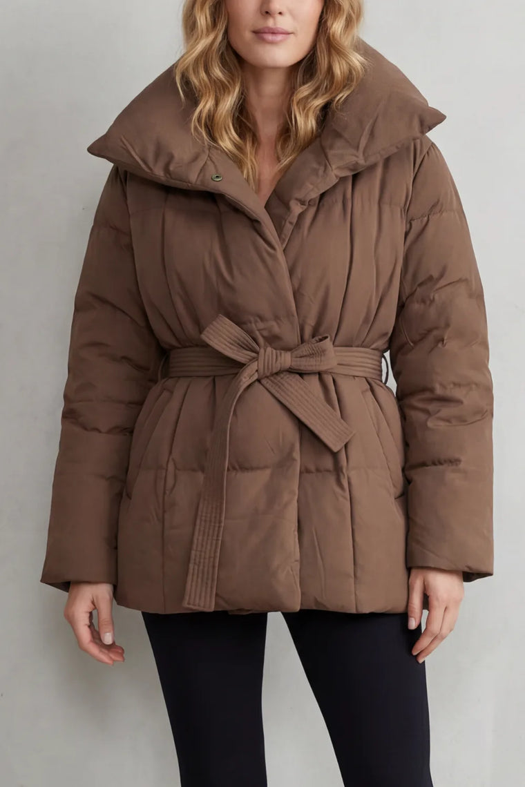 Oversized puffer jas met ceintuur