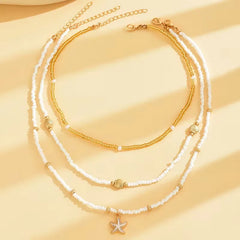 Ketting met schelp en ster