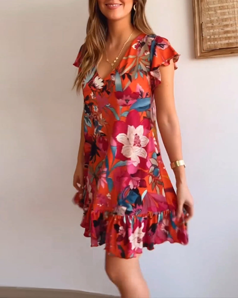 Bloemige Jurk met V-hals en Ruches in de kleur Rood voor dames in stijl ideaal voor de zomer.