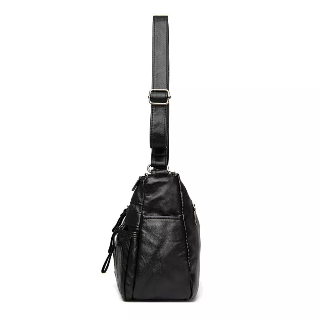 Carly Messenger Tas | Praktisch & vintage in de kleur Zwart voor dames in stijl geschikt voor alle seizoenen.