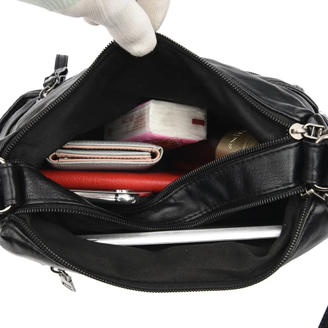 Carly Messenger Tas | Praktisch & vintage in de kleur Zwart voor dames in stijl geschikt voor alle seizoenen.