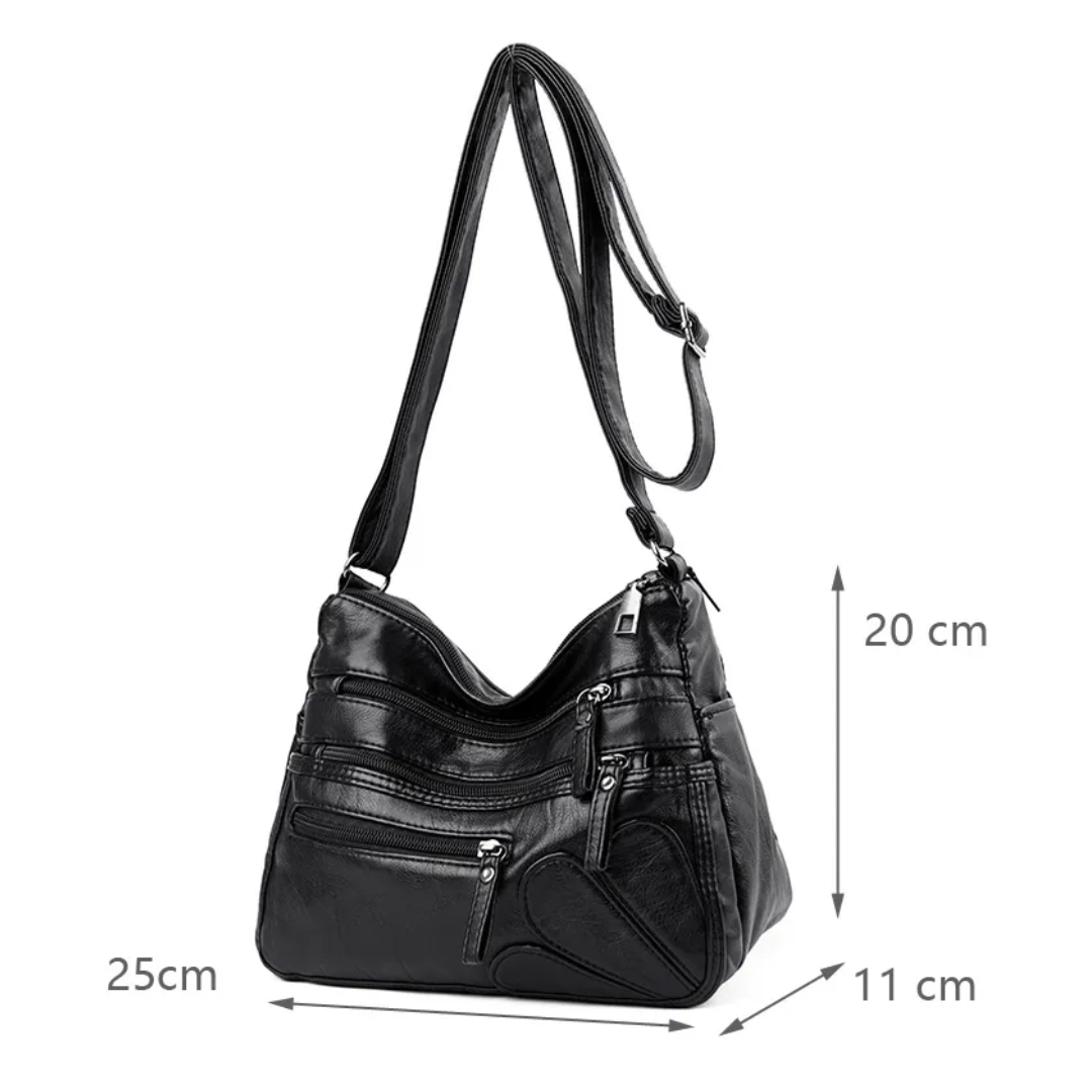 Carly Messenger Tas | Praktisch & vintage in de kleur Zwart voor dames in stijl geschikt voor alle seizoenen.