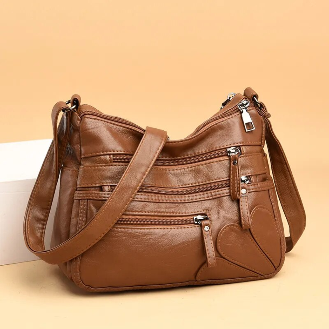 Carly Messenger Tas | Praktisch & vintage in de kleur Zwart voor dames in stijl geschikt voor alle seizoenen.