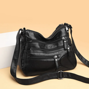 Carly Messenger Tas | Praktisch & vintage in de kleur Zwart voor dames in stijl geschikt voor alle seizoenen.