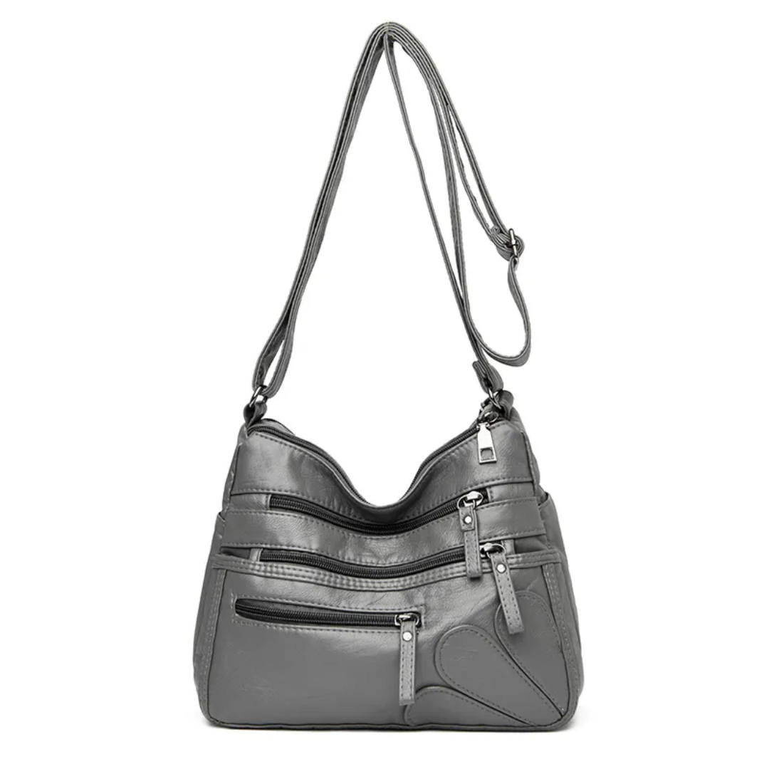 Carly Messenger Tas | Praktisch & vintage in de kleur Grijs voor dames in stijl geschikt voor alle seizoenen.