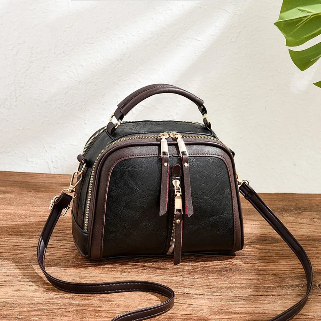 Carol Shell Handtas | Leuk & Modieus in de kleur Zwart voor dames in stijl geschikt voor alle seizoenen.