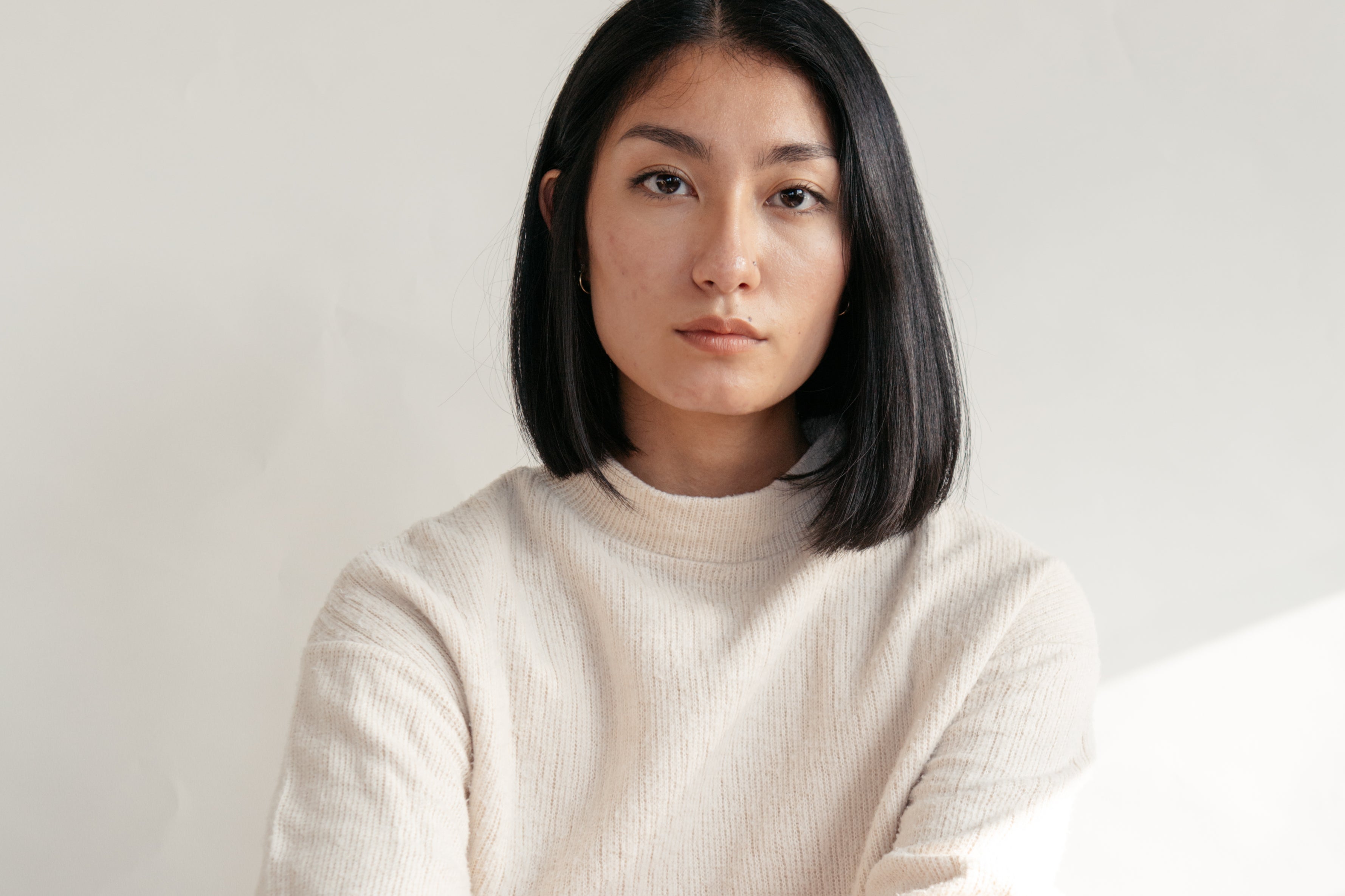 close-up-of-model-wearing-cream-sweater.jpg