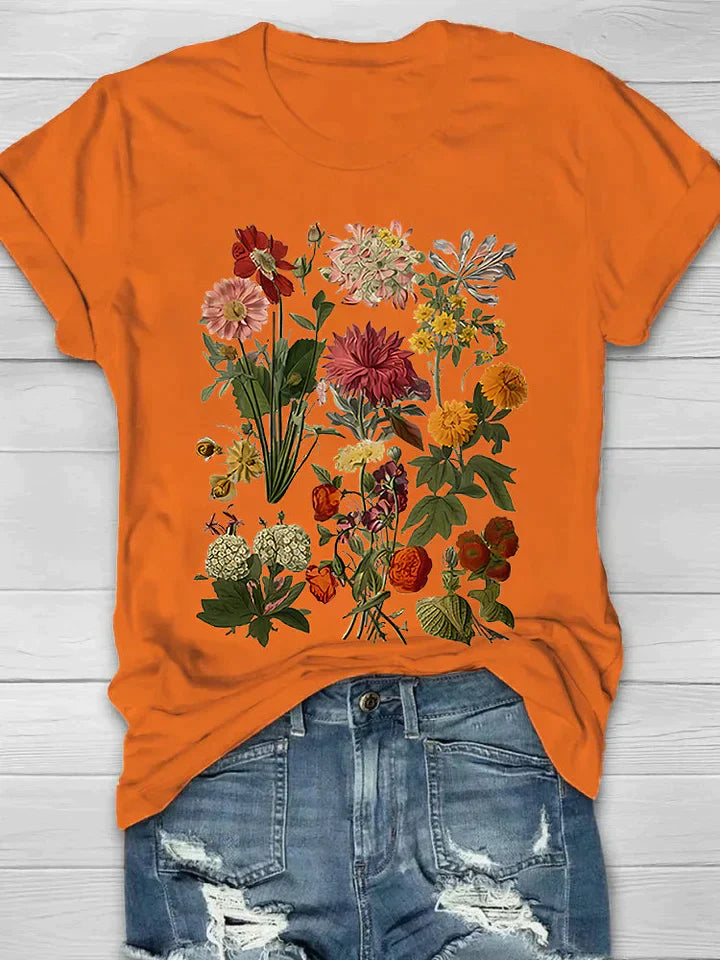 Vintage T-shirt met bloemenprint, perfecte combinatie van comfort en trendy stijl. Ideaal voor diverse gelegenheden en ontworpen voor bewegingsvrijheid.