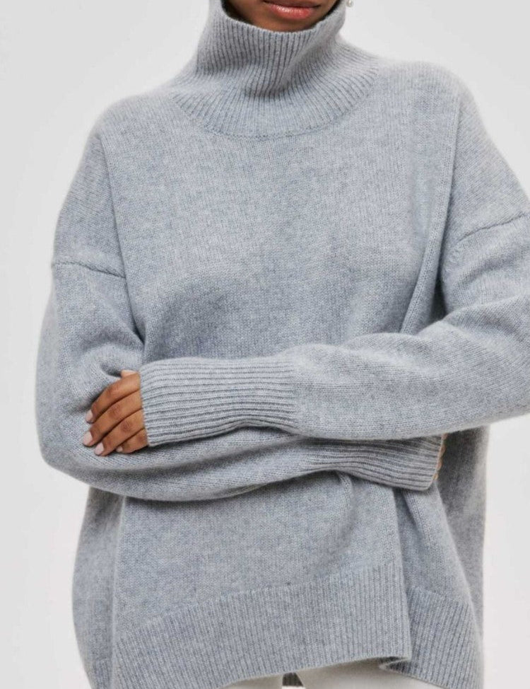 Dikke Coltrui met split in de kleur Grijs voor dames in stijl ideaal voor de herfst.