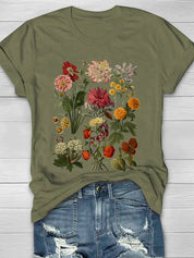 Vintage T-shirt met bloemenprint, perfecte combinatie van comfort en trendy stijl. Ideaal voor diverse gelegenheden en ontworpen voor bewegingsvrijheid.