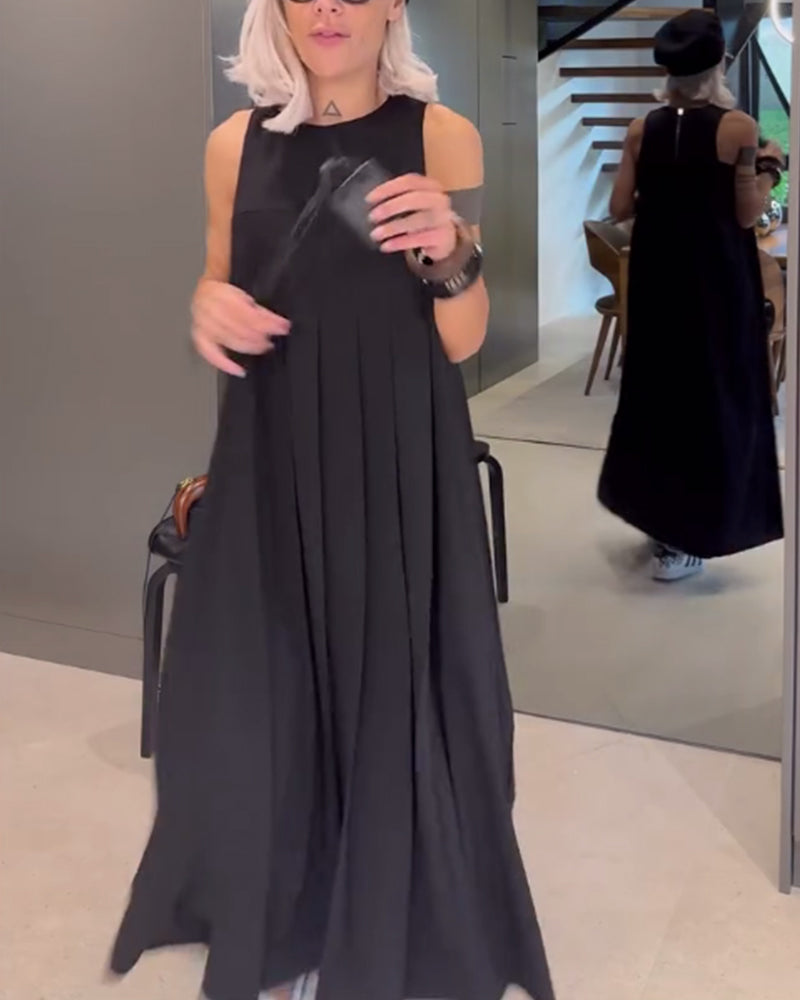 Elegante mouwloze jurk in effen kleur met een omslag in de kleur Zwart voor dames in stijl ideaal voor de lente.