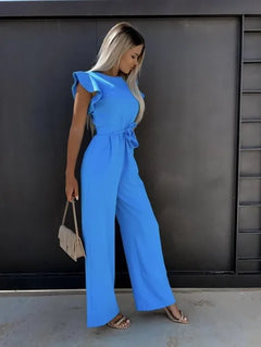 Deze jumpsuit combineert stijl, comfort en speelsheid met prachtige ruches mouwen en een ceintuur voor een flatterende en trendy uitstraling, geschikt voor diverse gelegenheden. Gemaakt van hoogwaardige materialen en veelzijdig inzetbaar voor zowel formele als informele events. Maattabel beschikbaar voor diverse EU-maten.