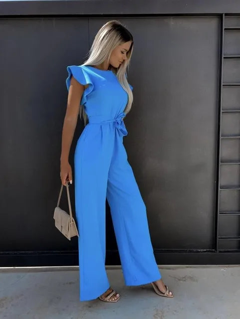 Deze jumpsuit combineert stijl, comfort en speelsheid met prachtige ruches mouwen en een ceintuur voor een flatterende en trendy uitstraling, geschikt voor diverse gelegenheden. Gemaakt van hoogwaardige materialen en veelzijdig inzetbaar voor zowel formele als informele events. Maattabel beschikbaar voor diverse EU-maten.
