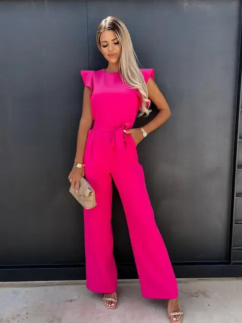 Deze jumpsuit combineert stijl, comfort en speelsheid met prachtige ruches mouwen en een ceintuur voor een flatterende en trendy uitstraling, geschikt voor diverse gelegenheden. Gemaakt van hoogwaardige materialen en veelzijdig inzetbaar voor zowel formele als informele events. Maattabel beschikbaar voor diverse EU-maten.