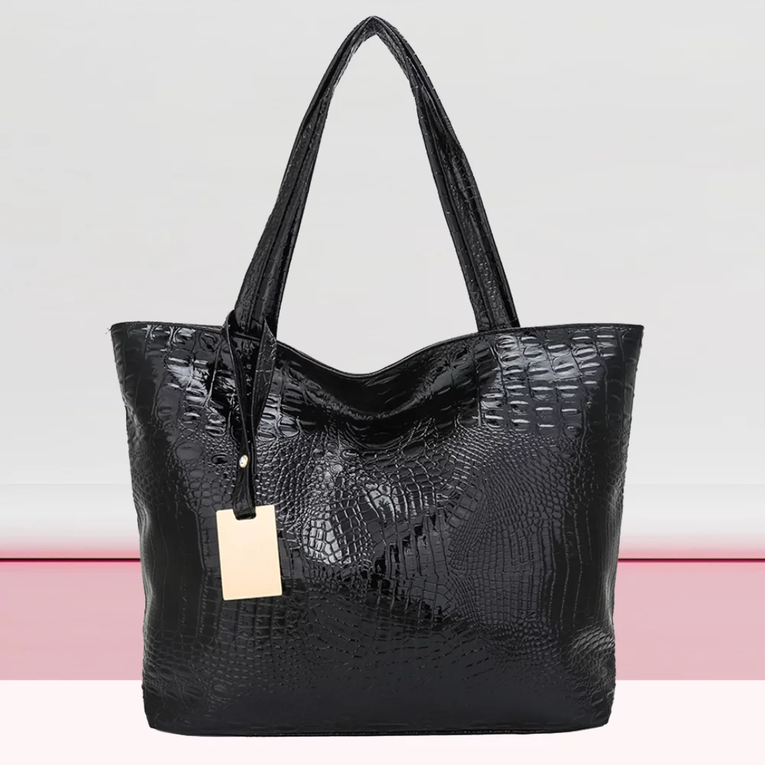 Isabella Schoudertas | Ruime tas met krokodillenprint in de kleur Zwart voor dames in stijl geschikt voor alle seizoenen.