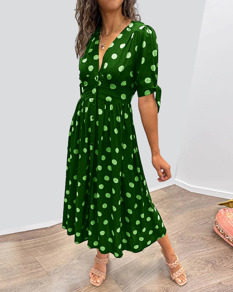 Jurk met diepe V-hals en stippen in de kleur Zwart voor dames in stijl ideaal voor de lente.