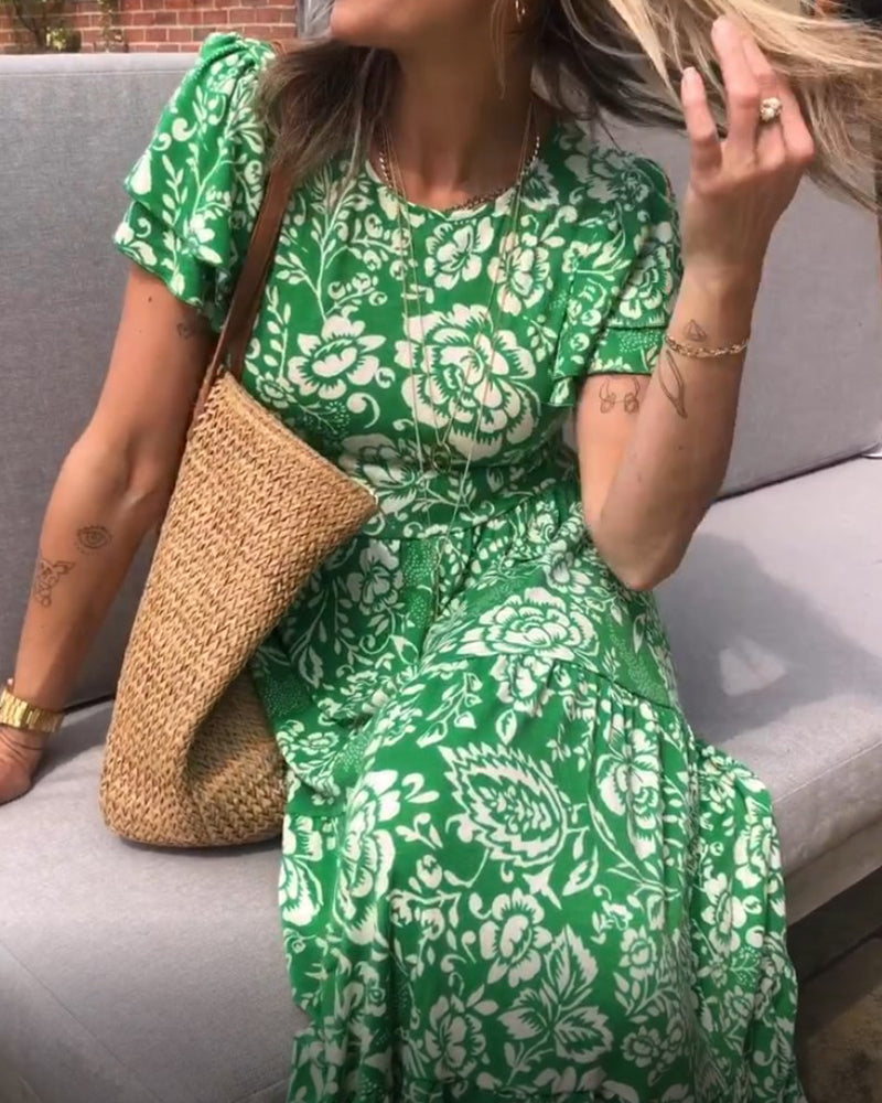 Lange jurk met korte mouwen en een bloemenprint in de kleur Groen voor dames in stijl ideaal voor de herfst.