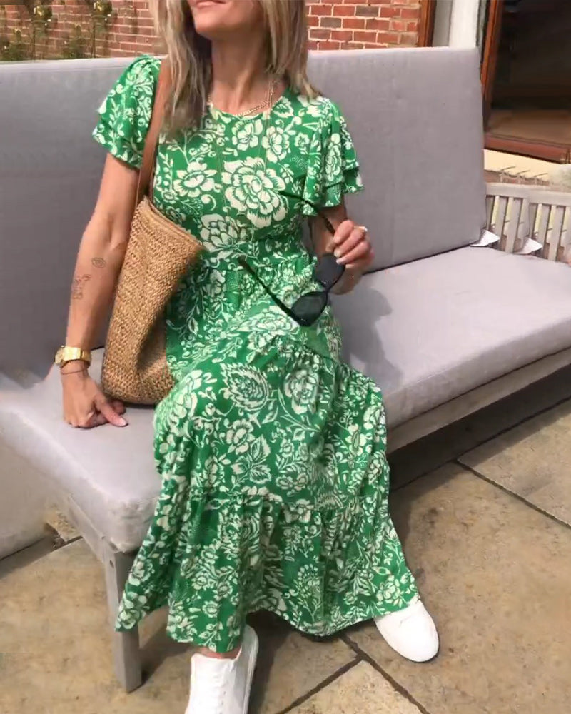 Lange jurk met korte mouwen en een bloemenprint in de kleur Groen voor dames in stijl ideaal voor de herfst.