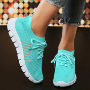 Lichtgewicht ademende orthopedische hardloopschoenen in de kleur Turquoise voor dames in stijl geschikt voor alle seizoenen.