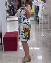 Mouwloze elegante jurk met bloemenprint in de kleur Wit voor dames in stijl ideaal voor de zomer.
