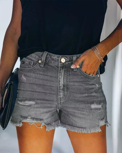 Mid-rise gescheurde denim shorts