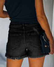 Mid-rise gescheurde denim shorts