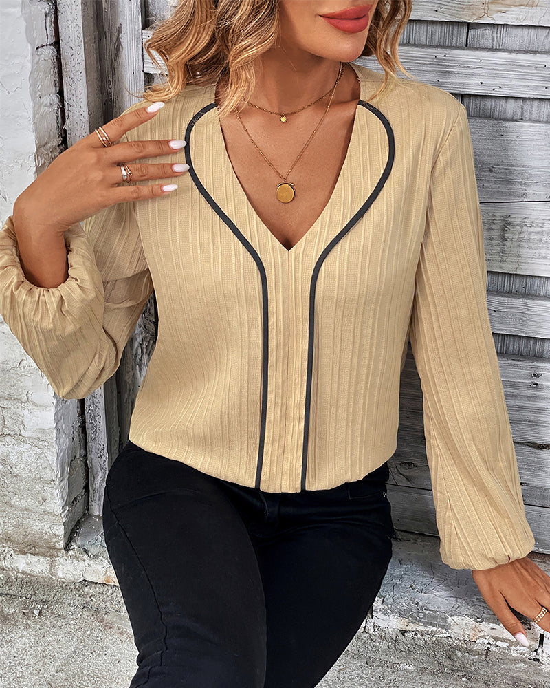 Elegante top met lange mouwen in de kleur Goud voor dames in stijl ideaal voor de herfst.