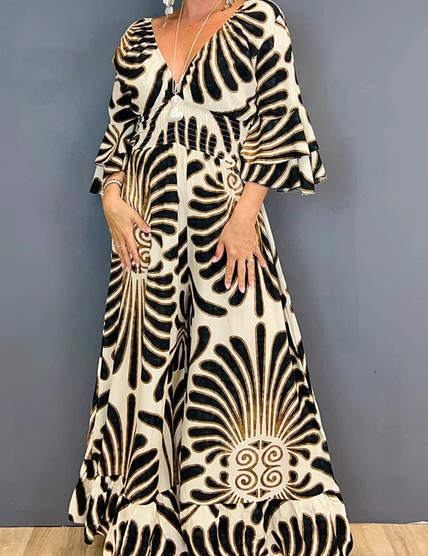 Gebloemde Jumpsuit in de kleur Goud voor dames in stijl ideaal voor de lente.