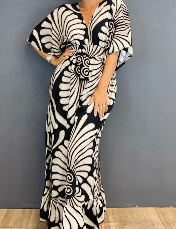Gebloemde Jumpsuit in de kleur Zwart voor dames in stijl ideaal voor de lente.