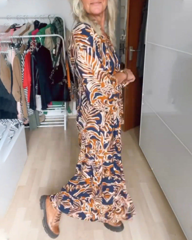 Maxi Jurk met V-hals Quincy in de kleur Oranje voor dames in stijl ideaal voor de herfst.